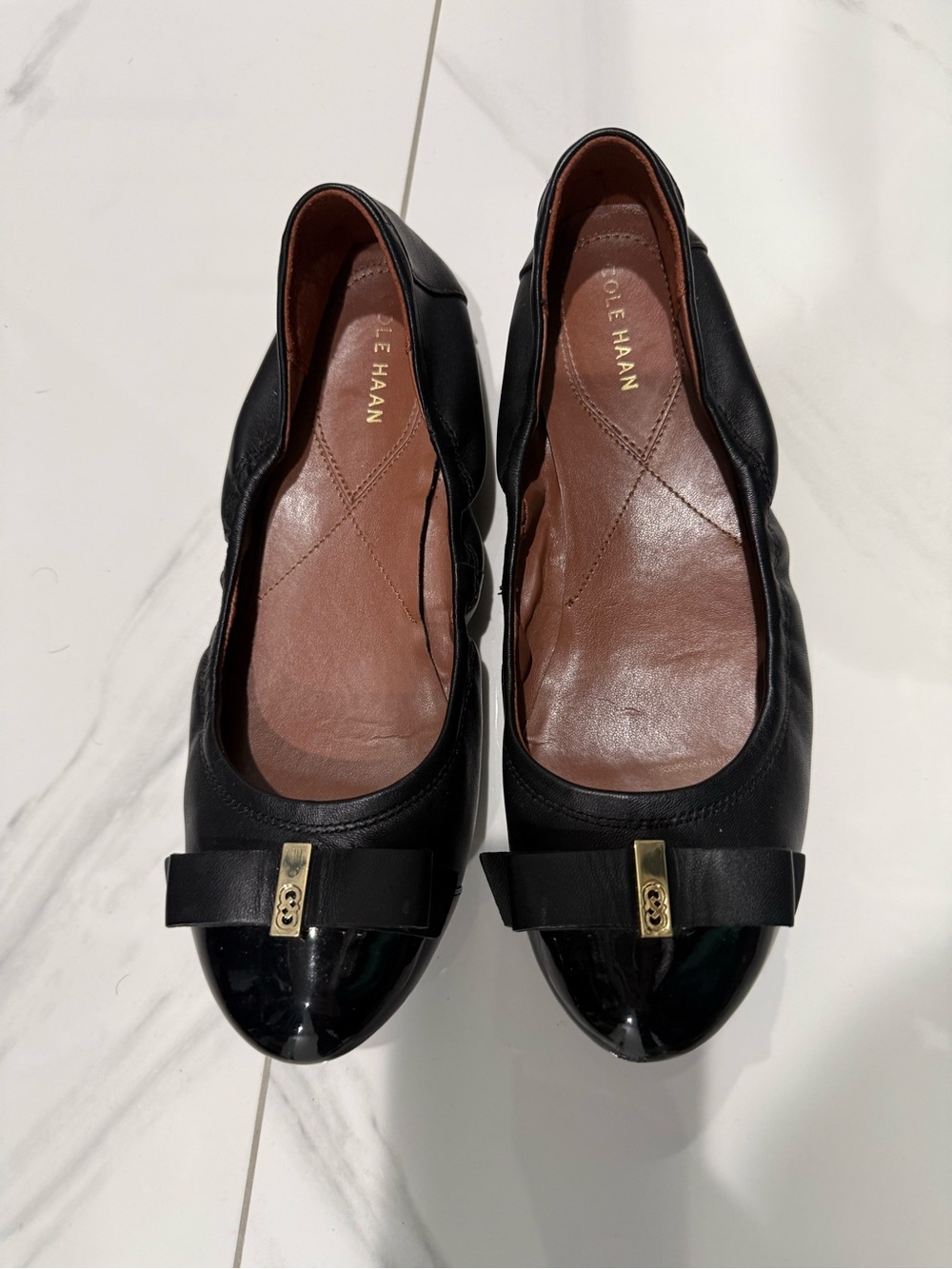 Cole Haan Black Leather Cap-Toe Ballet Flats with Gold Bow Accent